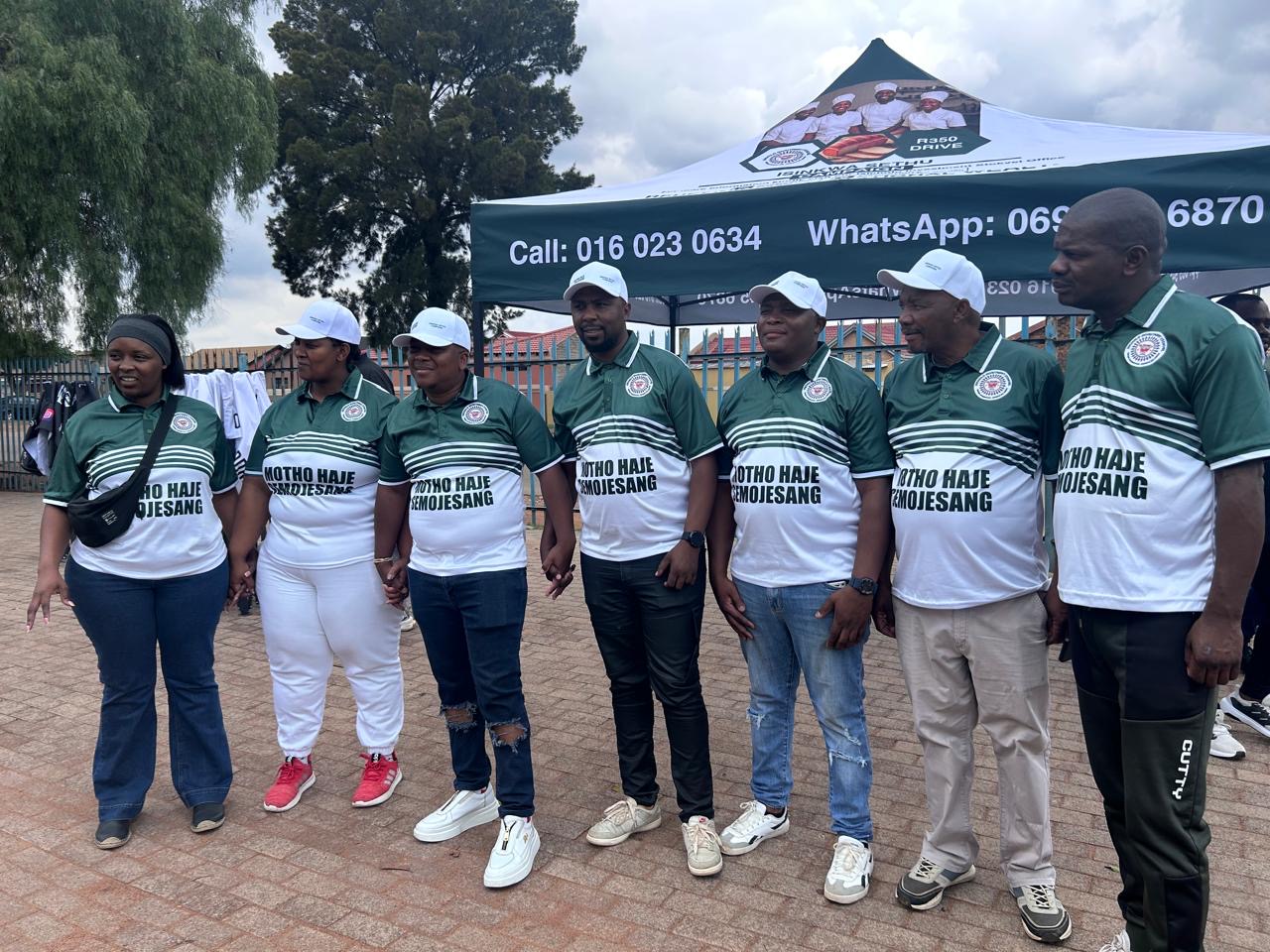 Isicholo Investment Stokvel members in branded jerseys standing together