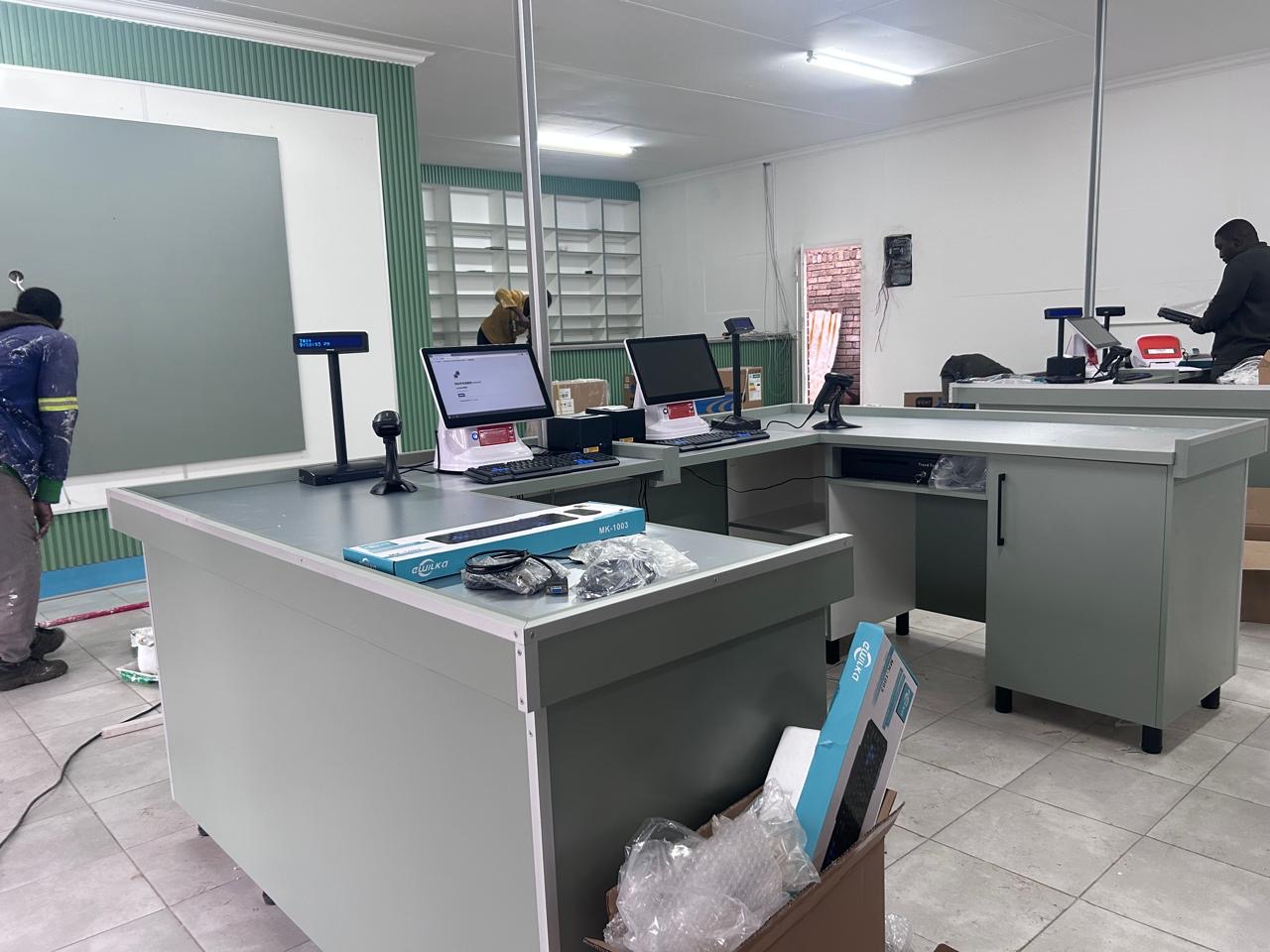 Newly fitted checkout counters with POS terminals at the Isicholo community supermarket